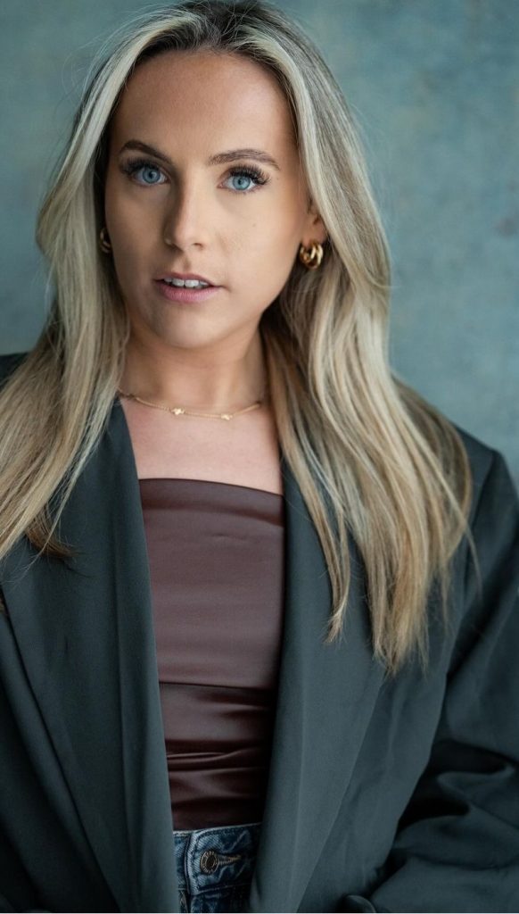 Devon Gray formal dress on blue-grey background